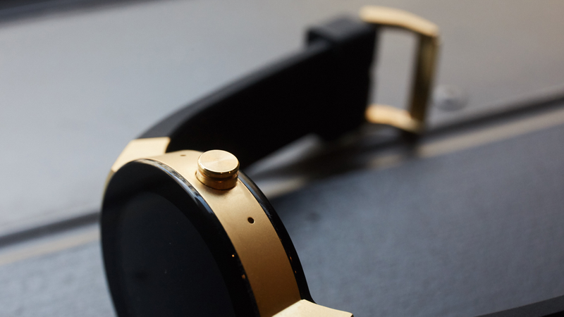 The watch has a single button, and two small microphones.